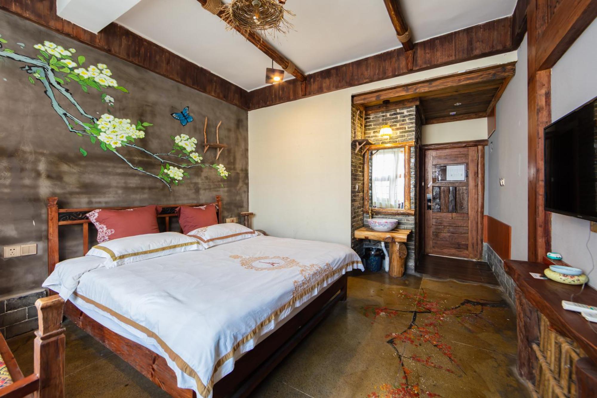 Butterfly Flowers Inn Чжанцзяцзе Экстерьер фото